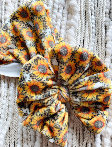Leopard and sunflowers